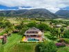 View of the cottage located at the rear of the property. Photo 14 of Launiupoko Luxury Estate modern home