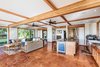 Modern home with Kitchen, Granite Counter, Ceiling Lighting, and Wood Cabinet. Even the cottage has beautiful wood beam details. Photo 15 of Launiupoko Luxury Estate