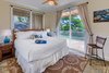 Modern home with Bedroom, Chair, Bed, Ceiling Lighting, and Slate Floor. One of two bedrooms in the cottage. Photo 16 of Launiupoko Luxury Estate