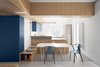 Modern home with Dining Room, Table, Chair, Wall Lighting, and Concrete Floor. View of the open kitchen Photo of Into the Woods