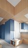 Modern home with Storage Room. Detail of the cross-shaped suspended furniture Photo 8 of Into the Woods