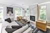 Modern home with Living Room, Recessed Lighting, Chair, Gas Burning Fireplace, Sectional, Light Hardwood Floor, and Accent Lighting. Living Room Photo 6 of The Rockcliffe Renovation