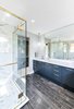 Modern home with Bath Room, Corner Shower, Marble Floor, Enclosed Shower, Ceiling Lighting, Soaking Tub, Drop In Tub, Undermount Sink, Porcelain Tile Wall, Pendant Lighting, Engineered Quartz Counter, Two Piece Toilet, and Recessed Lighting. Master Ensuite Photo 11 of The Rockcliffe Renovation