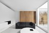 Modern home with Living Room, Coffee Tables, Gas Burning Fireplace, Painted Wood Floor, and Sofa. Living room Photo 9 of The House on Drolet Street