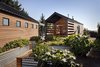 Modern home with Outdoor, Side Yard, Raised Planters, Gardens, and Vegetables. Custom raised planters made out of corrugated metal and wood. Photo 3 of Renton Hill House