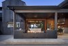 Modern home with Outdoor and Concrete Patio, Porch, Deck. Custom blackened steel fireplace. Photo 7 of Renton Hill House