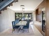 Modern home with Dining Room, Table, Pendant Lighting, Chair, Storage, and Ceramic Tile Floor. The dining room features a Basalt tile feature wall and wine storage. Photo 9 of Renton Hill House