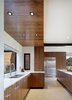 Modern home with Kitchen, Ceramic Tile Floor, Drop In Sink, Wood Cabinet, Dishwasher, and Microwave. Walnut cabinets and ample storage. Photo 15 of Renton Hill House