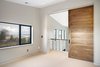 Modern home with Bedroom. The master suite features an oversized sliding door. Photo 18 of Renton Hill House