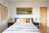 Modern home with Bedroom, Table Lighting, Night Stands, Bed, and Medium Hardwood Floor. Master Bedroom Photo 4 of Midcentury Dream House