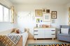 Modern home with Kids Room, Bed, Light Hardwood Floor, Bedroom Room Type, Chair, Dresser, Toddler Age, Neutral Gender, and Rug Floor. Kids Bedroom Photo 3 of Midcentury Dream House