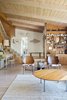 Modern home with Living Room, End Tables, Light Hardwood Floor, Pendant Lighting, Chair, Shelves, Rug Floor, Table Lighting, and Desk. Living Room Looking into Entry Way Photo 6 of Midcentury Dream House