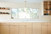 Modern home with Kitchen, Laminate Counter, Light Hardwood Floor, Wood Cabinet, Pendant Lighting, and Undermount Sink. Kitchen Photo 10 of Midcentury Dream House