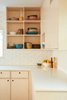Modern home with Kitchen, Wood Cabinet, Laminate Counter, and Ceramic Tile Backsplashe. Detail of Kitchen Photo 11 of Midcentury Dream House