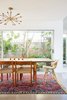 Modern home with Dining Room, Ceiling Lighting, Light Hardwood Floor, Table, Chair, and Rug Floor. Detail of Dining Room Photo 7 of Midcentury Dream House