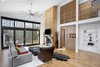 Modern home with Living Room, Coffee Tables, Sofa, Standard Layout Fireplace, Chair, Light Hardwood Floor, and Recessed Lighting. Living Area Photo 7 of House 16