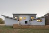 Modern home with Exterior, Shingles Roof Material, Wood Siding Material, Shed RoofLine, and House Building Type. Exterior Side Photo 4 of House 16