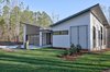 Modern home with Exterior, Butterfly RoofLine, Mid-Century Building Type, Shingles Roof Material, Flat RoofLine, Wood Siding Material, House Building Type, and Shed RoofLine. Exterior Front Photo 2 of House 23