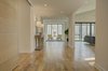 Modern home with Hallway and Light Hardwood Floor. Entry Hall - Looking down spine to Seating Nook. Photo 5 of House 23