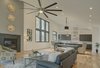 Modern home with Living Room, Coffee Tables, Chair, Light Hardwood Floor, Recessed Lighting, Sofa, and Standard Layout Fireplace. Living Area - Looking towards Dining and Kitchen Photo 6 of House 23