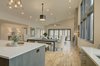 Modern home with Dining Room, Pendant Lighting, Light Hardwood Floor, Recessed Lighting, Table, Bench, and Chair. Kitchen - Looking toward Living Area Photo 7 of House 23