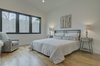 Modern home with Bedroom, Night Stands, Chair, Recessed Lighting, Bed, and Light Hardwood Floor. Master Bedroom Photo 8 of House 23