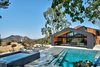 Modern home with Exterior, House Building Type, Metal Roof Material, and Wood Siding Material. Saddle Peak Residence by AUX Architecture Photo of Saddle Peak Residence