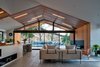 Modern home with Living Room, Sofa, Gas Burning Fireplace, Ceiling Lighting, Medium Hardwood Floor, Accent Lighting, and Recessed Lighting. Saddle Peak Residence by AUX Architecture Photo 6 of Saddle Peak Residence