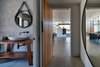 Modern home with Bath Room, Wood Counter, and Stone Tile Wall. Saddle Peak Residence by AUX Architecture Photo 7 of Saddle Peak Residence