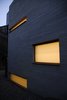 Modern home with Exterior, Mid-Century Building Type, House Building Type, Concrete Siding Material, Flat RoofLine, Brick Siding Material, and Shingles Roof Material. New master bath cuboid extension with CMU block. Photo 3 of Summers