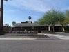 Modern home with Exterior, Flat RoofLine, Shingles Roof Material, House Building Type, Hipped RoofLine, Concrete Siding Material, Metal Roof Material, and Brick Siding Material. Front elevation of the house with fabric 'eye brow' and landscaped yard Photo 8 of Summers