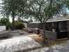 Modern home with Exterior, Hipped RoofLine, House Building Type, Brick Siding Material, Metal Roof Material, Shingles Roof Material, Metal Siding Material, and Concrete Siding Material. Front yard Photo 9 of Summers