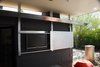 Modern home with Exterior, Shingles Roof Material, Flat RoofLine, Gable RoofLine, Concrete Siding Material, Brick Siding Material, and House Building Type. New patio that floats and allows hot air to escape. Roof gutters harvest rainwater Photo 14 of Summers