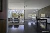 Modern home with Ceiling Lighting, Concrete Floor, and Pendant Lighting. Dining room with a covered patio and fabric curtain(open position) for privacy and harsh south sun. Photo 14 of Essence of the Desert
