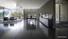 Modern home with Concrete Floor, Pendant Lighting, and Ceiling Lighting. Entry courtyard to the right and dinning room in the front flanked by covered glass patio. Photo 17 of Essence of the Desert