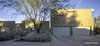 Modern home with Exterior, Concrete Siding Material, House Building Type, and Flat RoofLine. The notch in the masonry fence wall receives the setting sun of the owners' marriage anniversary. Photo 12 of Essence of the Desert