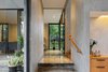 Modern home with Living Room, Floor Lighting, Sofa, Concrete Floor, and Wall Lighting. The transition space from dining room to living room Photo of House of Inside and Outside