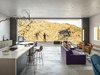 Using a natural material palette helps Ridge Mountain Residence by Ehrlich Yanai Rhee Chaney Architects blend in with its surroundings: the concrete complements the light browns and tans of the surrounding mountains, while Cor-ten steel cladding provides a naturally weathering material. Photo 11 of Ridge Mountain Residence modern home