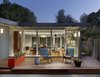 Modern home with Exterior, Glass Siding Material, House Building Type, Flat RoofLine, and Stucco Siding Material. To make the home feel bigger without enlarging the footprint, we removed the large central room divider to create a bright, open space. Photo of Tamalpais Street Residence