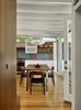 Modern home with Hallway and Light Hardwood Floor. Custom walnut built-ins offer hidden storage along one side of the hallway. Photo 5 of Tamalpais Street Residence