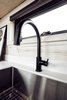 Large, stainless under-mounted sink makes real cooking and cleaning as easy as it is in a typical house. Photo 6 of Land Ark RV - Drake modern home