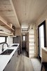 Modern home with Ceiling Lighting. The tall ladder lives secured against the wall, but can be attached to either the guest loft or storage soffit, providing access to either.
Photo 15 of Land Ark RV - Drake