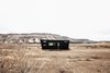Modern home with Exterior, Camper Building Type, Metal Siding Material, and Tiny Home Building Type. Large for a tiny house RV, but still small - especially in the western landscape. Photo 9 of Land Ark RV - Drake