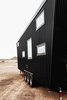 The light and shadows on the corrugated metal create a visible texture and intricacy of scale that changes with the sun and viewing angle. Photo 12 of Land Ark RV - Drake modern home