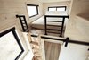 The loft ladder can be hung against the wall as shown or secured at an angle for ergonomic climbing. The master loft easily fits a king size bed. Ladder and built-ins designed by Land Ark, cut and assembled by Twig Custom Builders. Photo 17 of Land Ark RV - Drake modern home