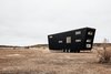The low sloped roof appears steeper from different angles, giving the house a sort of visual movement even while it's stationary. Photo 20 of Land Ark RV - Drake modern home