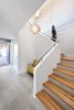 Modern home with Staircase, Wood Tread, Concrete Tread, and Metal Railing. Staircase with special wood decor. Photo 5 of House KI