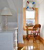 Modern home with Table Lighting and Chair. The queen bedroom Photo 11 of Featherbed Island House. Bayfront Vacation Rental
