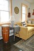 Modern home with Living Room, Floor Lighting, Sofa, Bookcase, End Tables, Ottomans, Chair, Dark Hardwood Floor, Table Lighting, and Coffee Tables. The music room Photo 9 of Featherbed Island House. Bayfront Vacation Rental