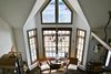 Modern home with Living Room, Table Lighting, Accent Lighting, Dark Hardwood Floor, Ceiling Lighting, and Chair. The great room Photo 2 of Featherbed Island House. Bayfront Vacation Rental